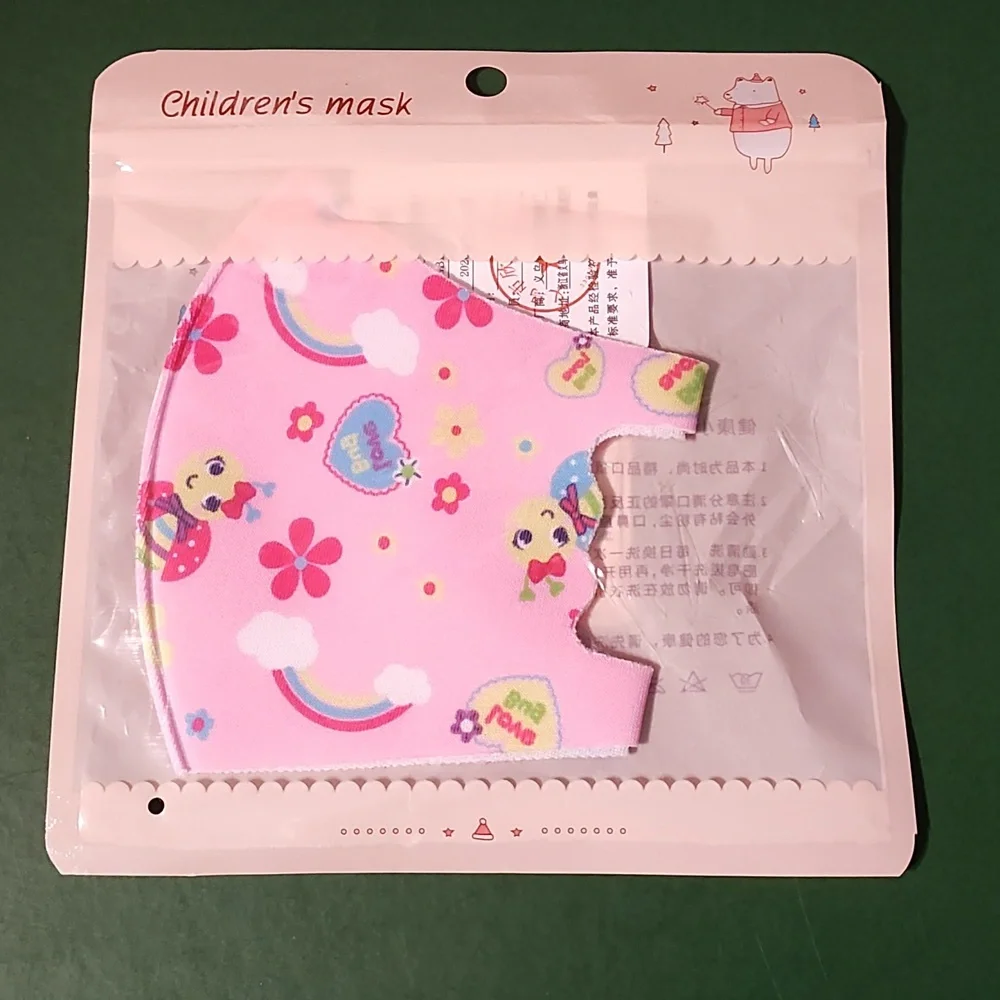 Children's re Usable face mask new in package never opened